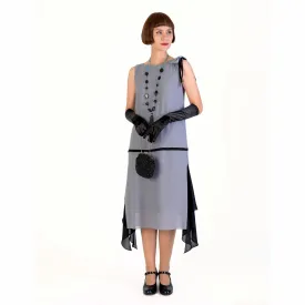 Grey party dress in 1920s style with black details and shoulder bow